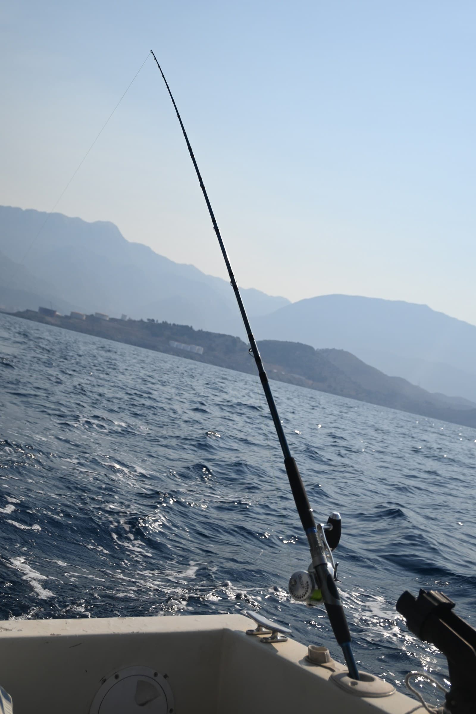 A fishing rod set over the water during a day out near Bar.