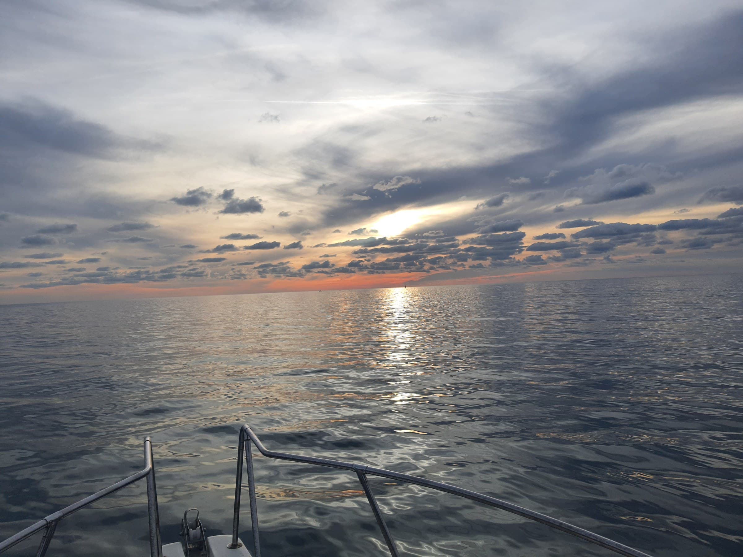 Calm sea at dawn near Bar, seen from a small boat before the day begins.