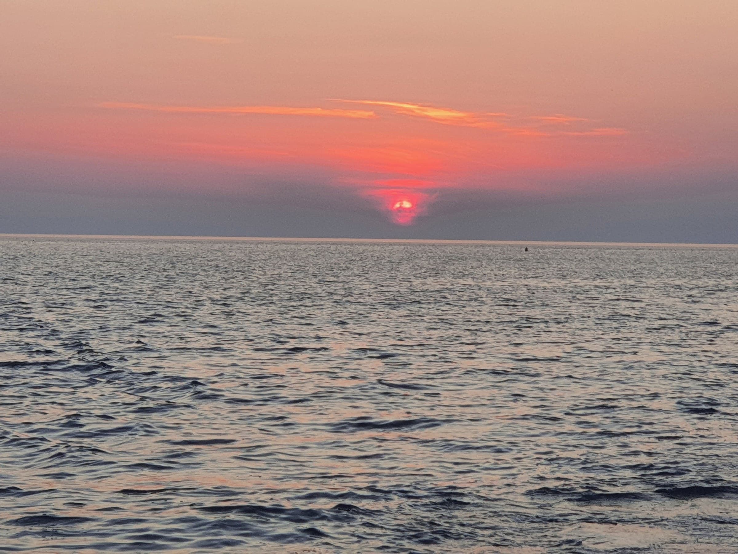 Evening light over the sea near Bar, seen from a small boat.